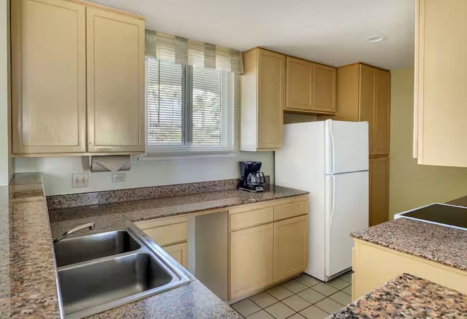 Prepare easy meals with granite counters and full-size appliances.