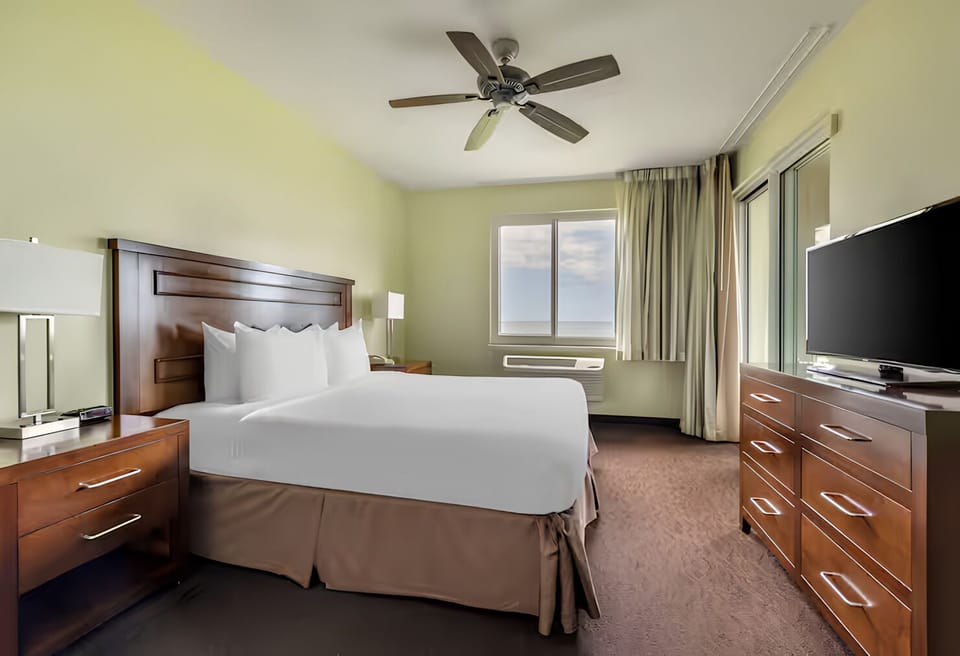 Wake up to ocean breezes in a serene king bedroom.