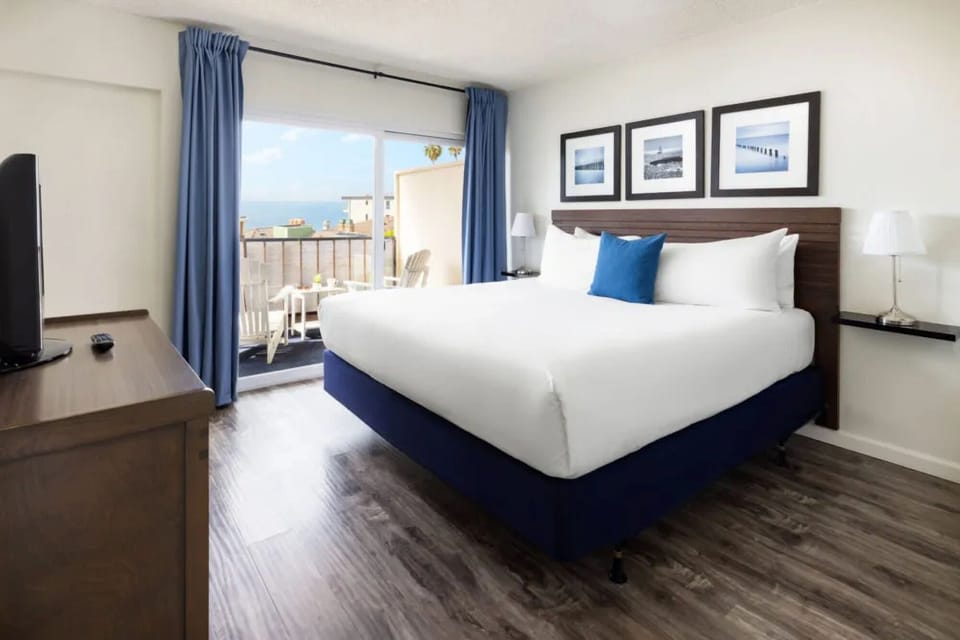 Unit with 1 king bed and 1 queen bed. Exact unit will be assigned upon arrival. Views, colors, and decor may vary.