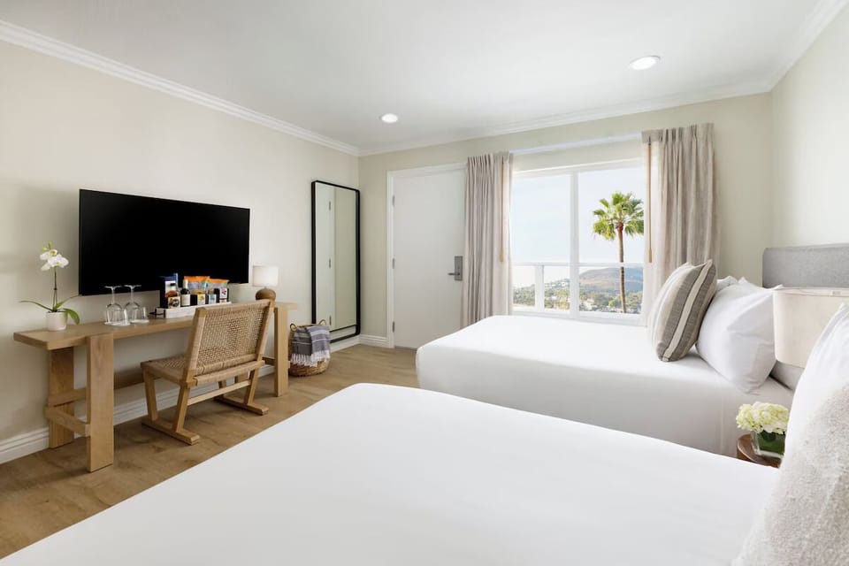 Unit with 2 Full beds. Exact unit will be assigned upon arrival. Views, colors, and decor may vary.