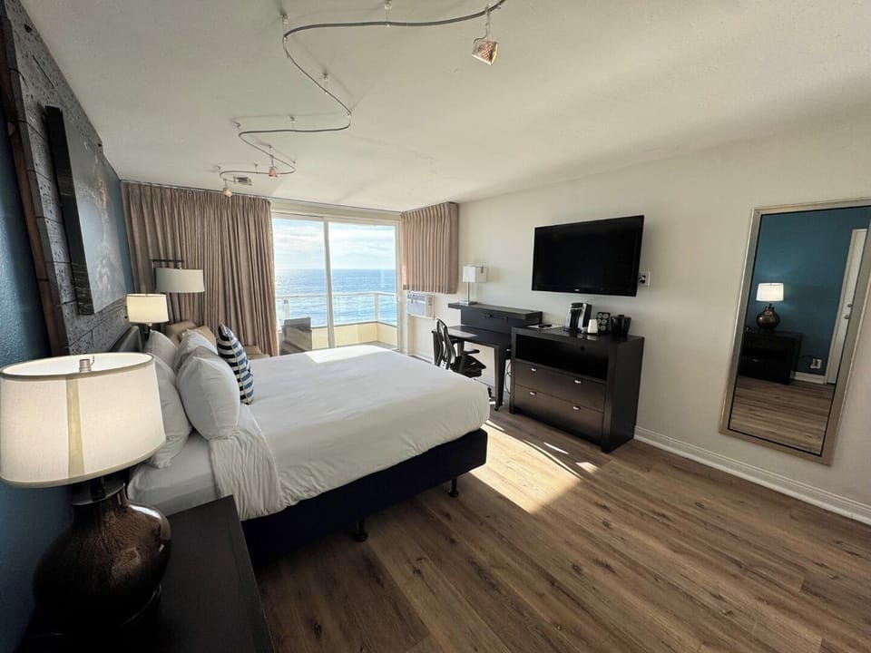 Unit with king bed. Exact unit will be assigned upon arrival. Views, colors, and decor may vary.