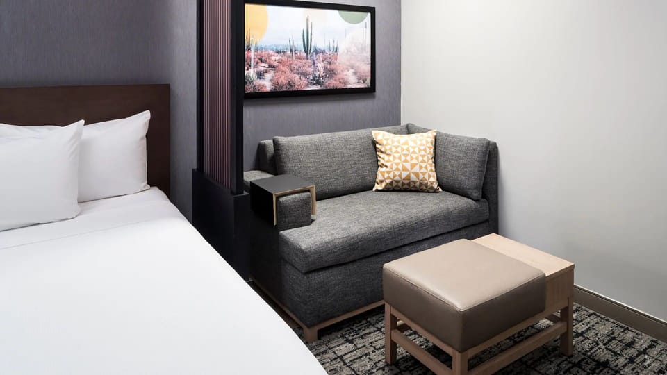 Stretch out on two plush beds in a bright suite.