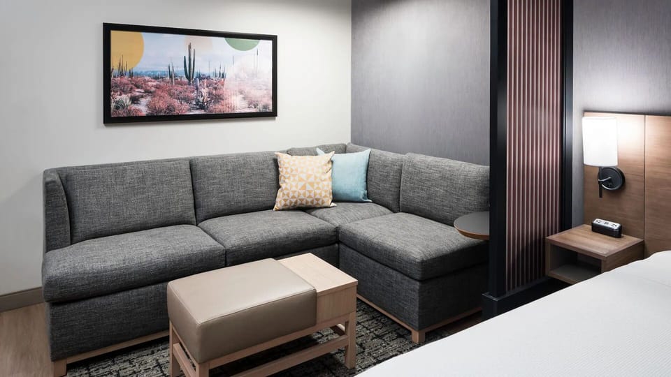Relax into the sectional with pillows and soft ambient lighting.