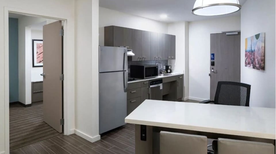 Cook and dine with ease in a sleek, modern kitchenette.