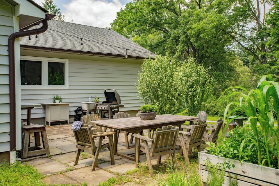 Patio with outdoor dining and BBQ area.
