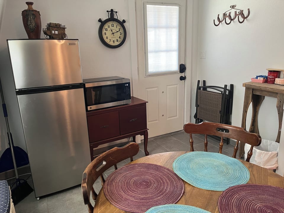Kitchen with fridge & microwave