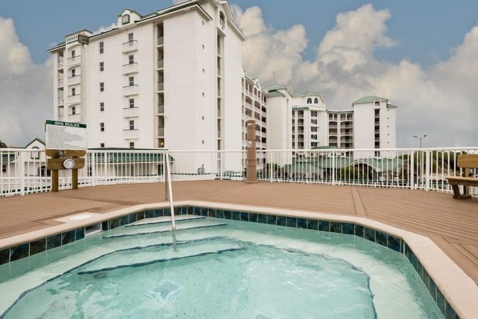 The outdoor hot tub provides a relaxing retreat where guests can unwind and enjoy scenic views, pairing perfectly with family-friendly amenities and beach access.