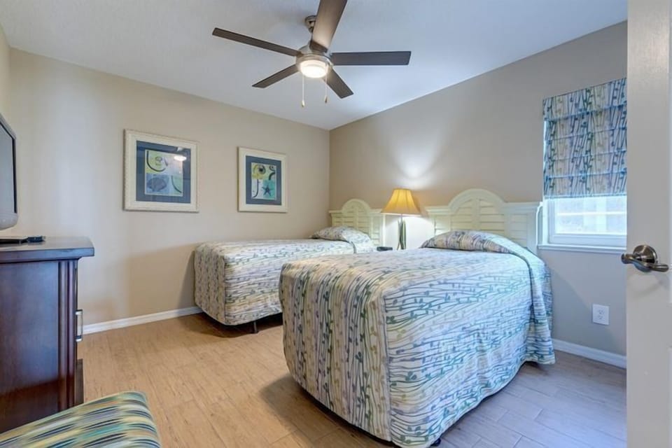Delight in the charm of this well-appointed room, ideal for families with two cozy beds and ample space.