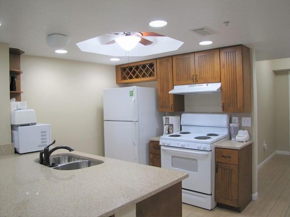 Cook up a storm in the well-equipped kitchen, complete with modern appliances and ample counter space, making meal preparation a breeze during your beachfront stay.