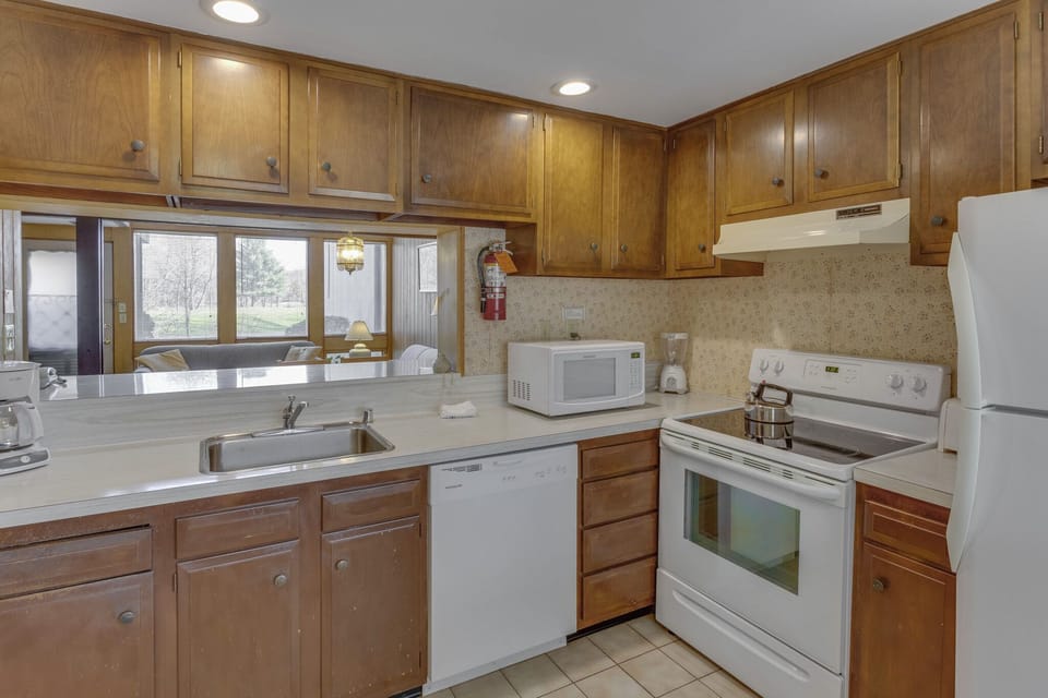 Cook delicious meals in the fully equipped kitchen, designed for convenience with modern appliances and ample counter space.
