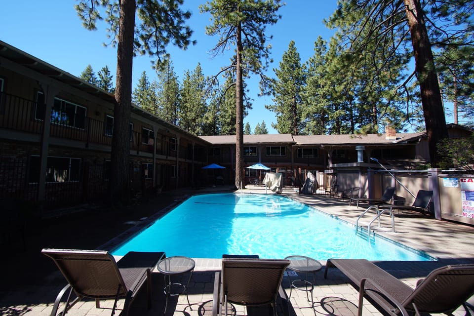 Bright pool view with seating area