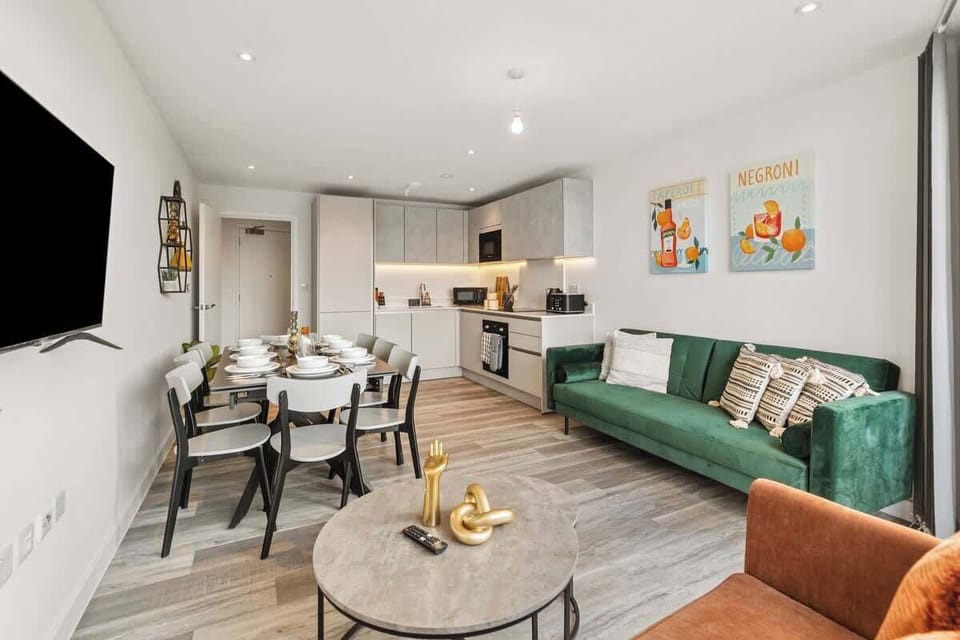 - Cozy living space with modern sofa and dining area combined  
- Kitchen and lounge designed for Airbnb guest comfort daily  
- Perfect balance of dining relaxation and group gathering  