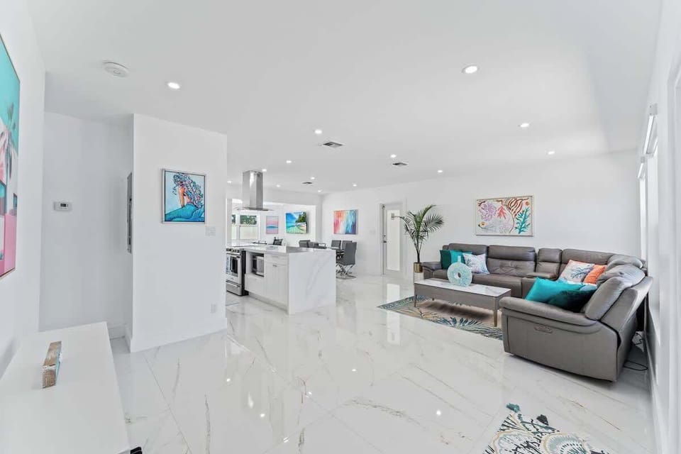 Cozy meets modern in this bright, open-concept living space; perfect for lounging, entertaining, or just soaking up the Florida vibes in style!