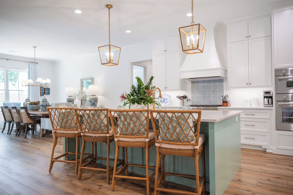 Elegant kitchen with high end appliances and bar top seating
