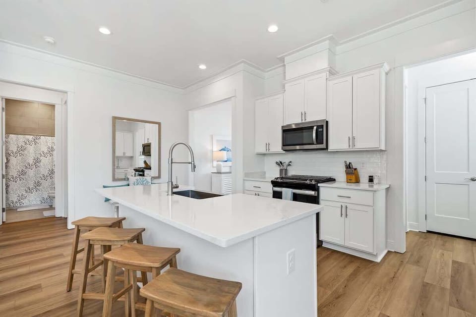 Beautiful open concept kitchen. Gourmet Kitchen: Whip up delights in a bright, modern space with sleek appliances and stylish decor!