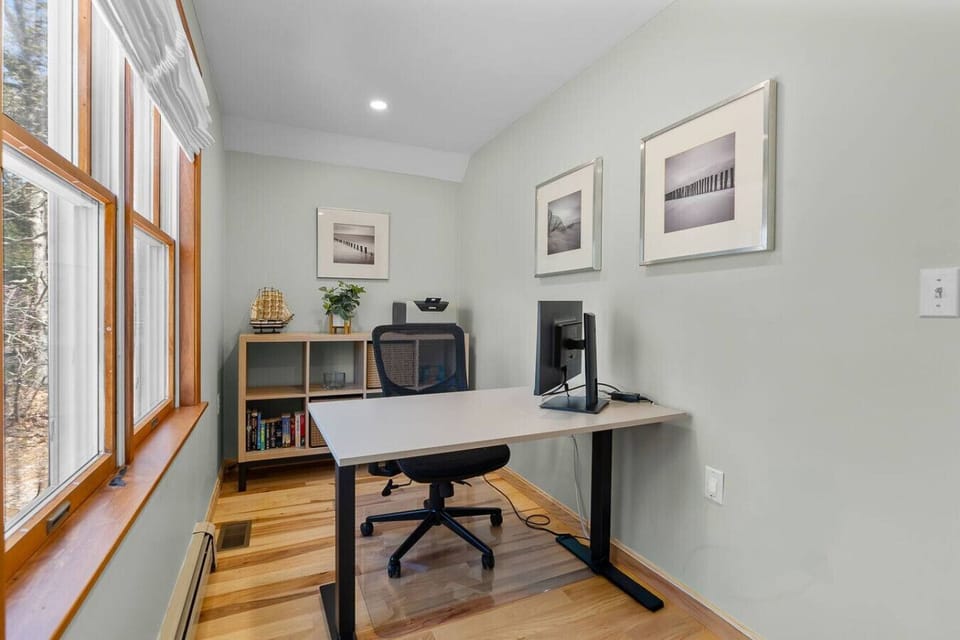Large, bright dedicated workspace with a comfortable chair and an extra monitor. This office is located in the back of bedroom #1.