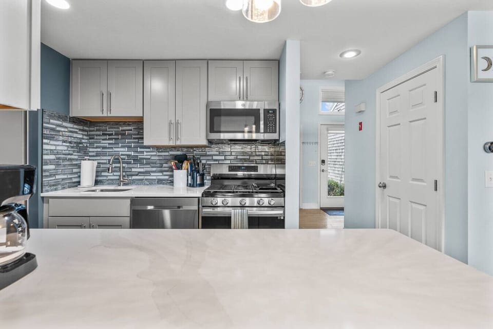 Fully-equipped kitchen with seating for two at the counter plus a dining table to eat your meals at. We provide all the essentials, including a drip coffee maker.
