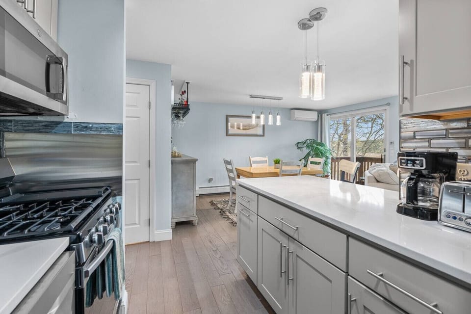 Fully-equipped kitchen with seating for two at the counter plus a dining table to eat your meals at. We provide all the essentials, including a drip coffee maker.
