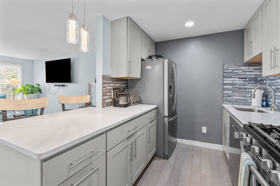 Fully-equipped kitchen with seating for two at the counter plus a dining table to eat your meals at. We provide all the essentials, including a drip coffee maker.