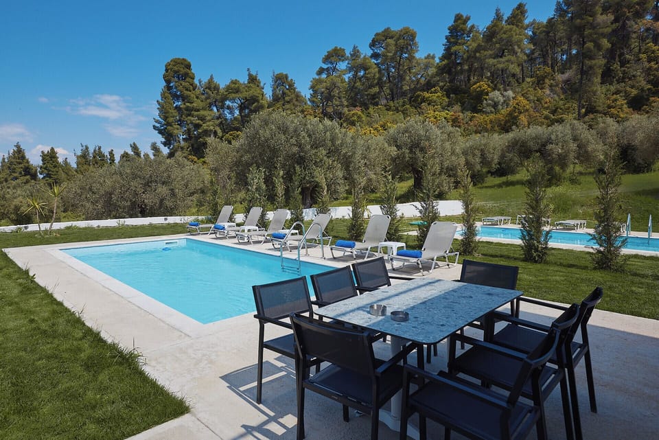Private pool with outdoor dining area – luxury villa in Halkidiki surrounded by 