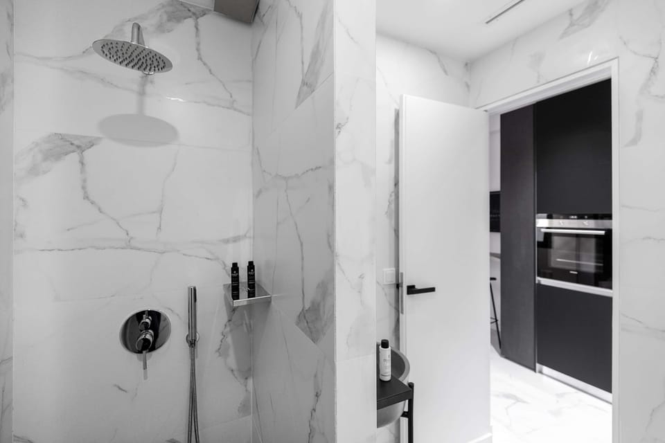 Walk-in rainfall shower provides a spacious, refreshing experience frequently praised by past visitors.