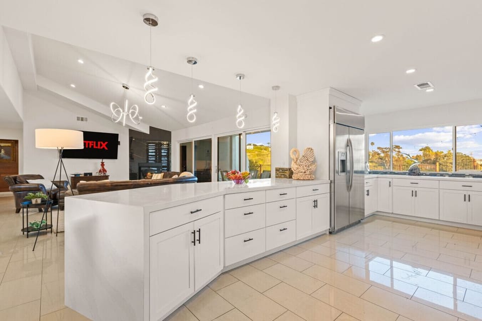 Sleek, spacious kitchen with a large island perfect for gathering.