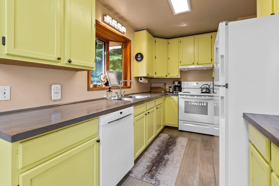Fully stocked galley style kitchen