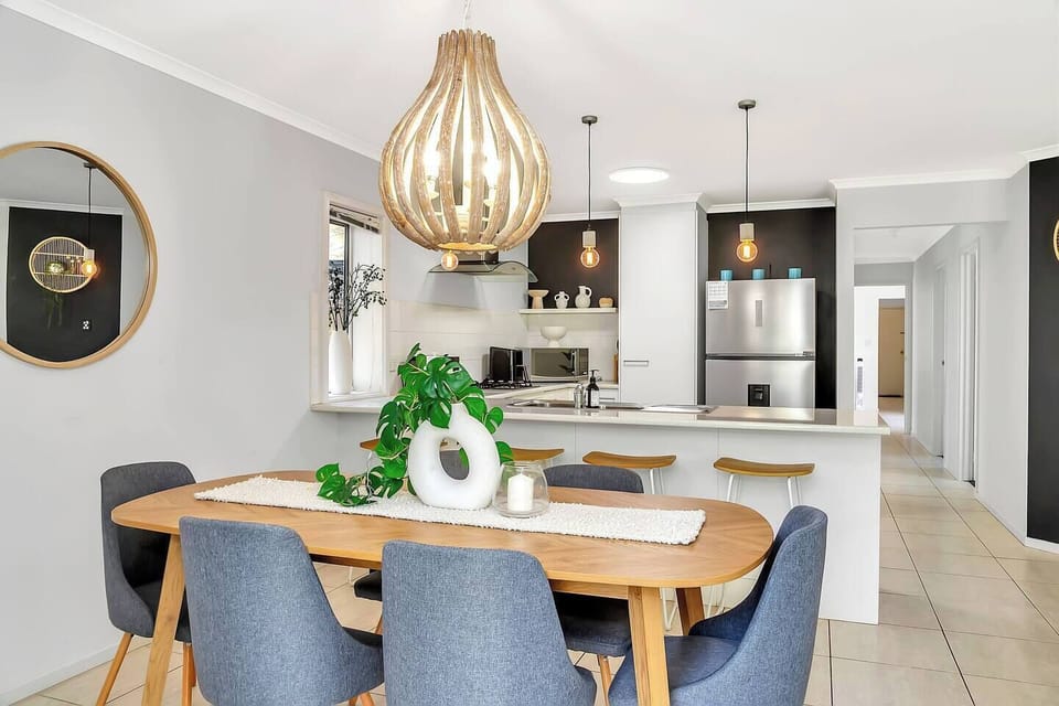 Light-filled dining space with seating for six, perfect for family meals or working on your laptop.