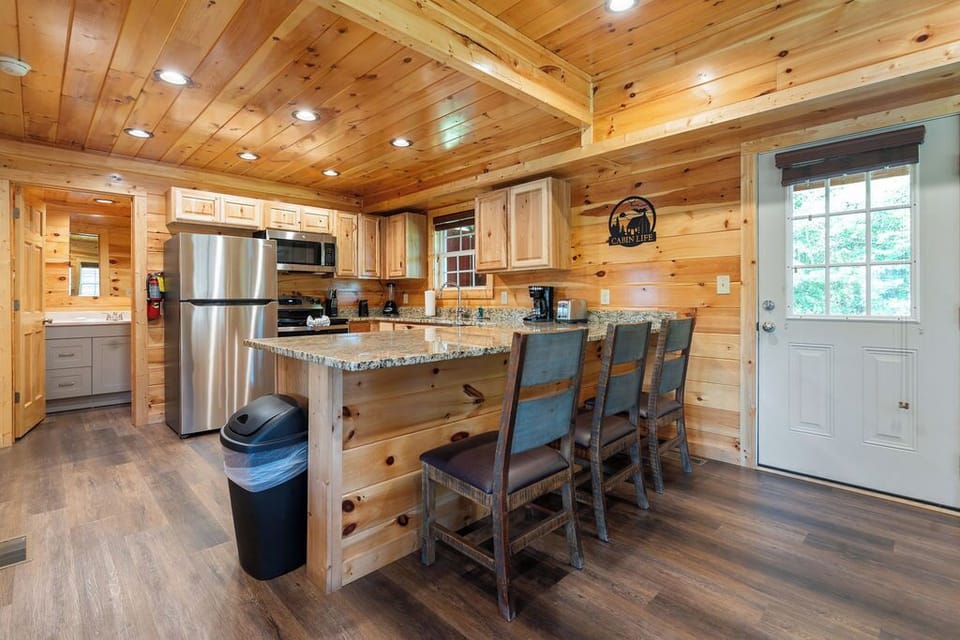 Gather for meals with a view in our cozy, rustic cabin dining area for all.