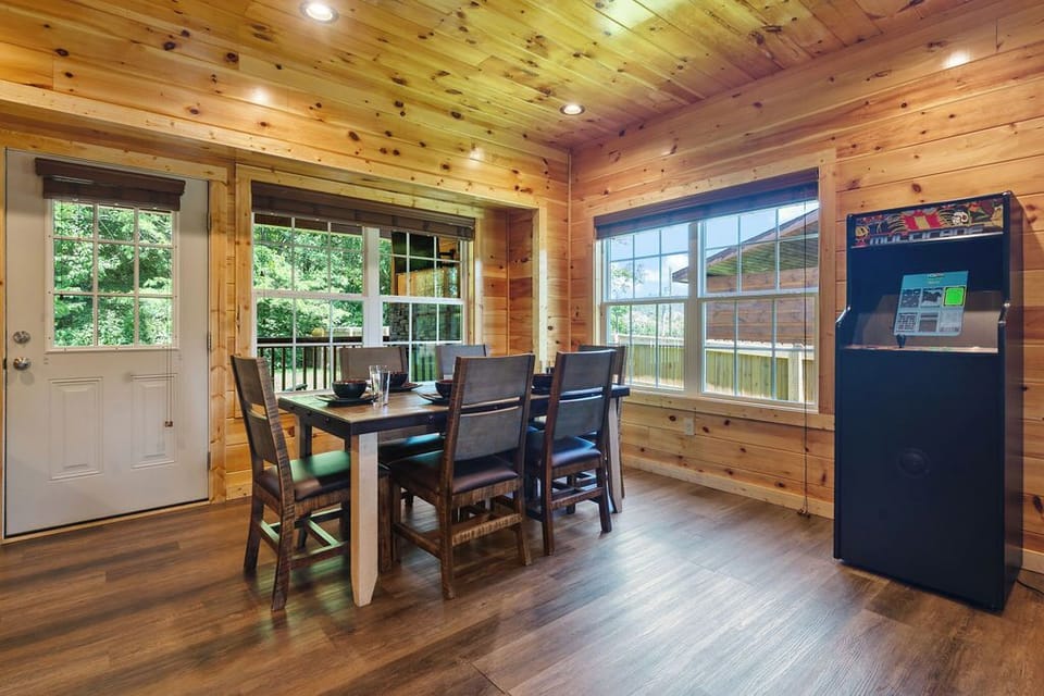 Gather for meals with a view in our cozy, rustic cabin dining area for all.