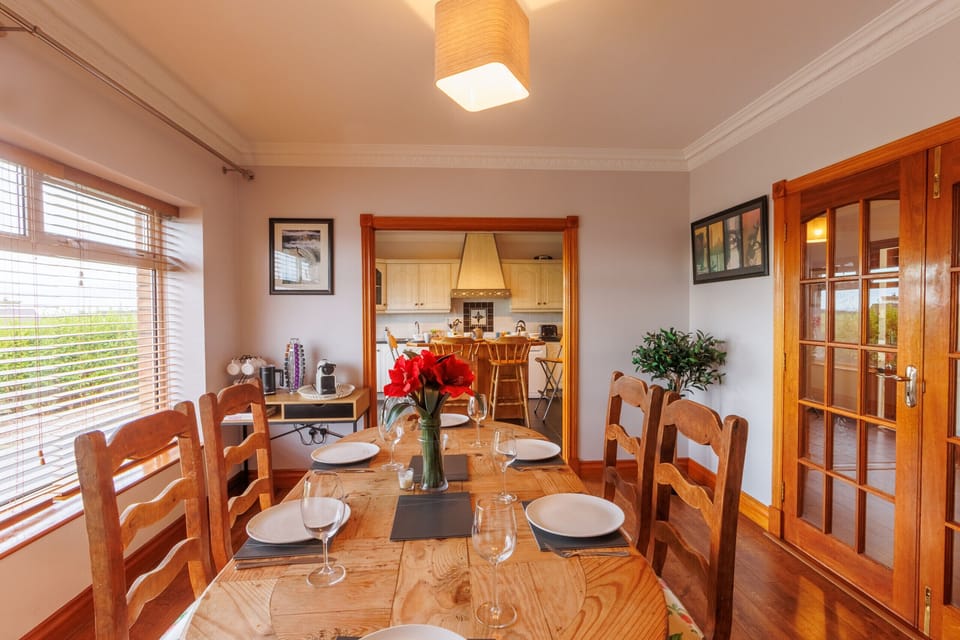 This bright and spacious dining room is ideal for a delicious family meal