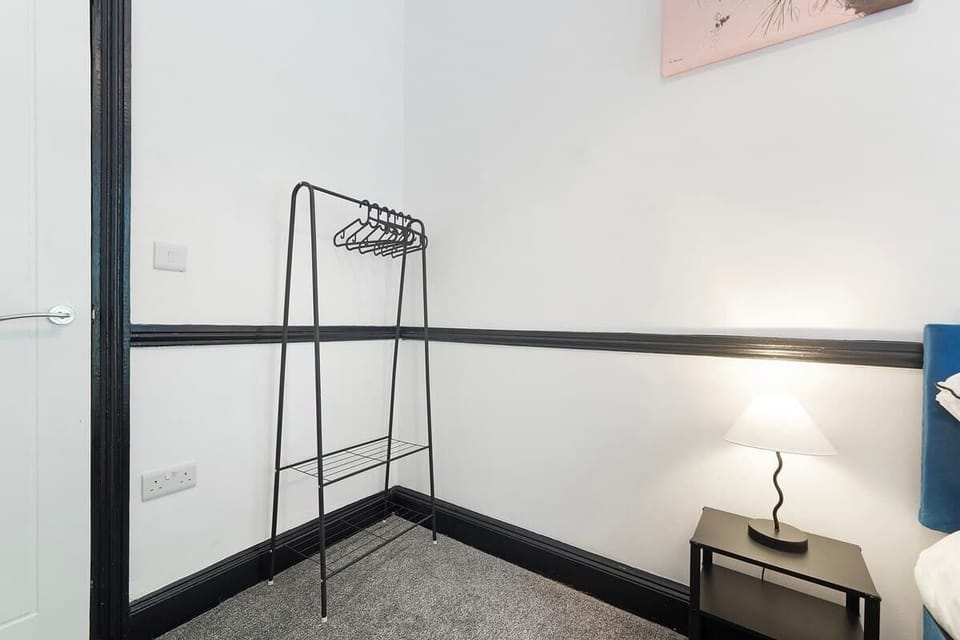 Bedroom 1 offers flexibility and comfort with a cozy double bed, ensuring a restful retreat for a peaceful night's sleep.