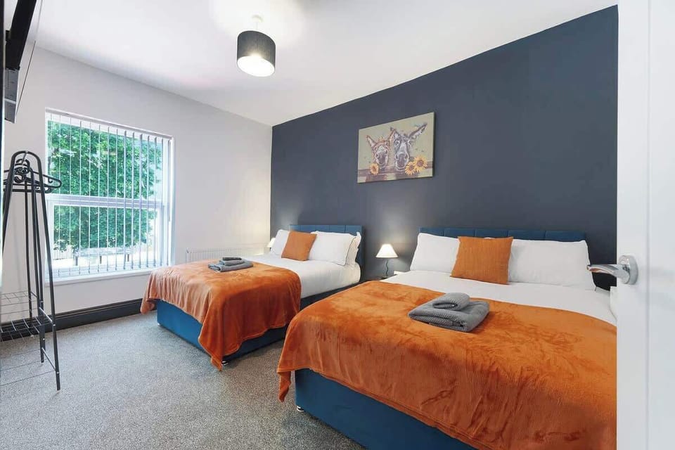 Bedroom 3 offers flexibility and comfort with a cozy two double bed, ensuring a restful retreat for a peaceful night's sleep.