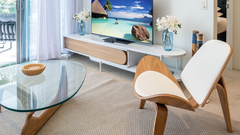 Sleek, modern, and entertainment-ready. Our stylish living area features high-end designer seating and a curated media setup for your ultimate comfort.