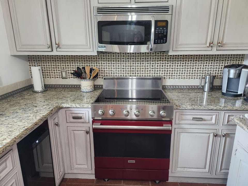 Well-appointed kitchen with custom cabinetry and Viking appliances