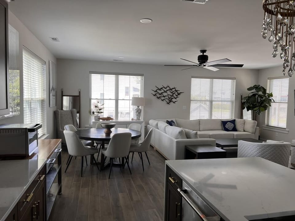 Open-concept living and dining area with plenty of natural light, perfect for relaxing or entertaining.