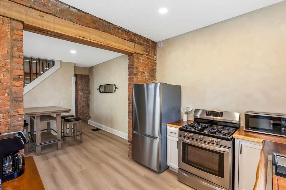 Kitchen with stainless appliances and open layout. 
