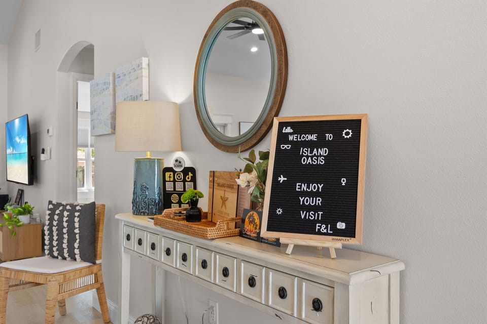 Entryway: Step into Island Oasis with vibrant decor and a warm welcome! Your adventure begins here!