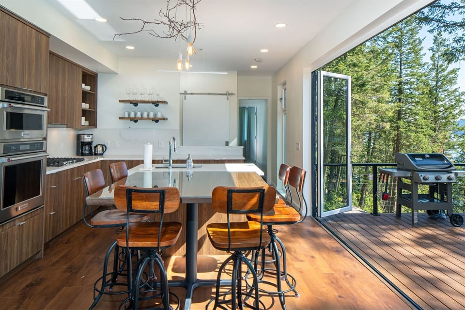 The modern, fully equipped kitchen is perfect for creating memorable meals for your group | Main Floor