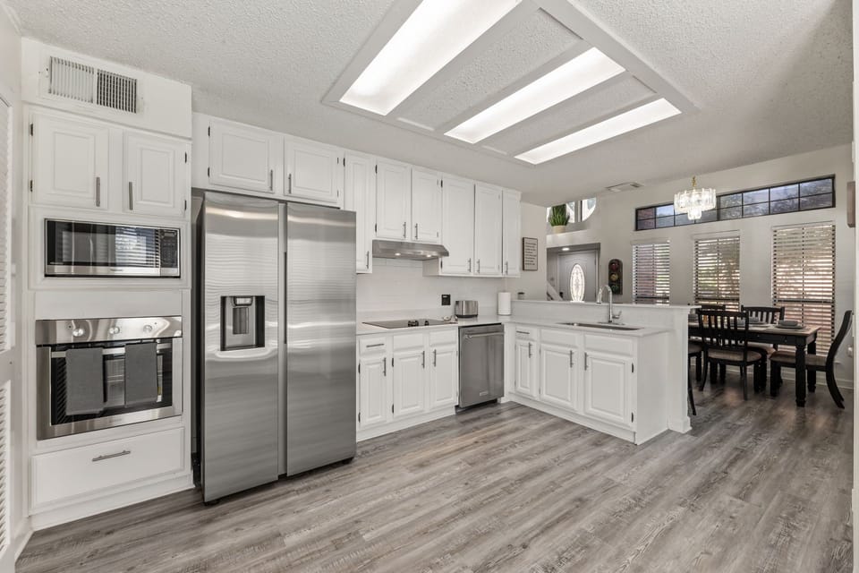 Fully equipped kitchen with modern appliances.