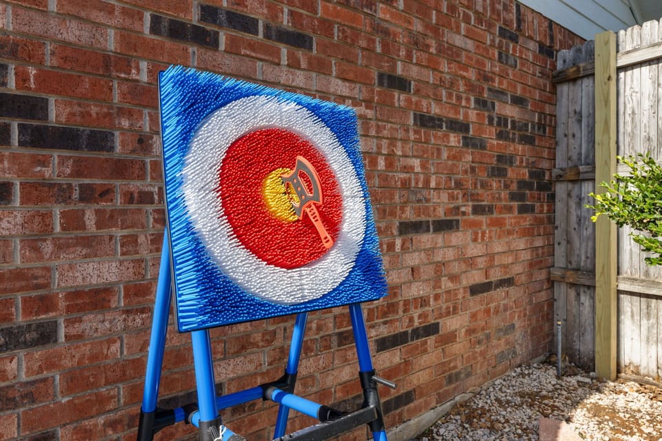 Axe throwing station for a unique backyard experience.