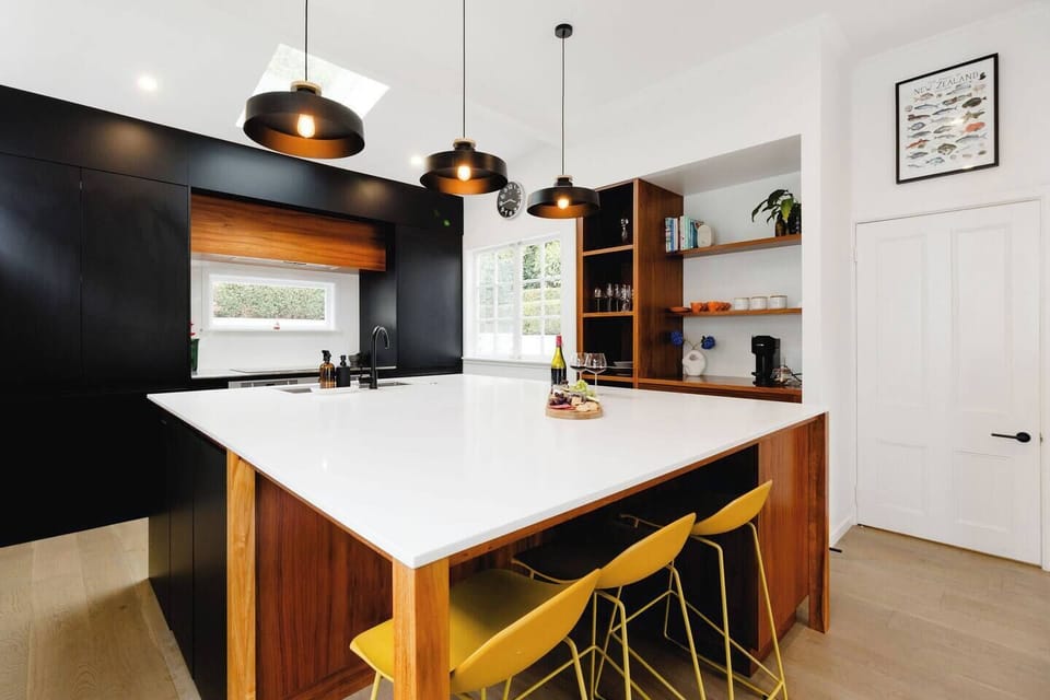 Large, sunny kitchen with enormous island for eating, preparing and entertaining.