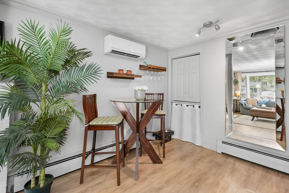 Dining area off of living room with seating for two