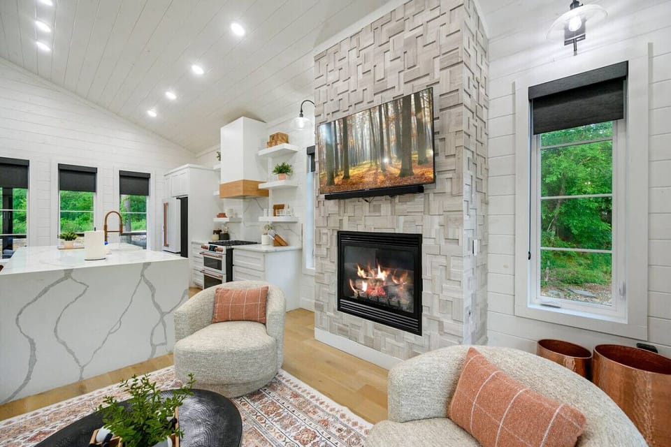 Where crackling fires and modern design come together—kick back, relax, and stay awhile.