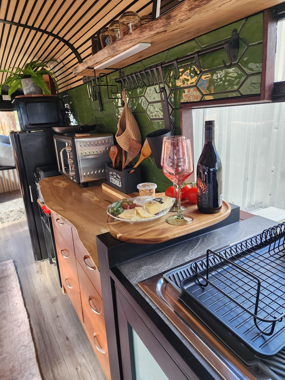 This little kitchen has a fullsize fridge,microwave, small ovenwith hotplates.