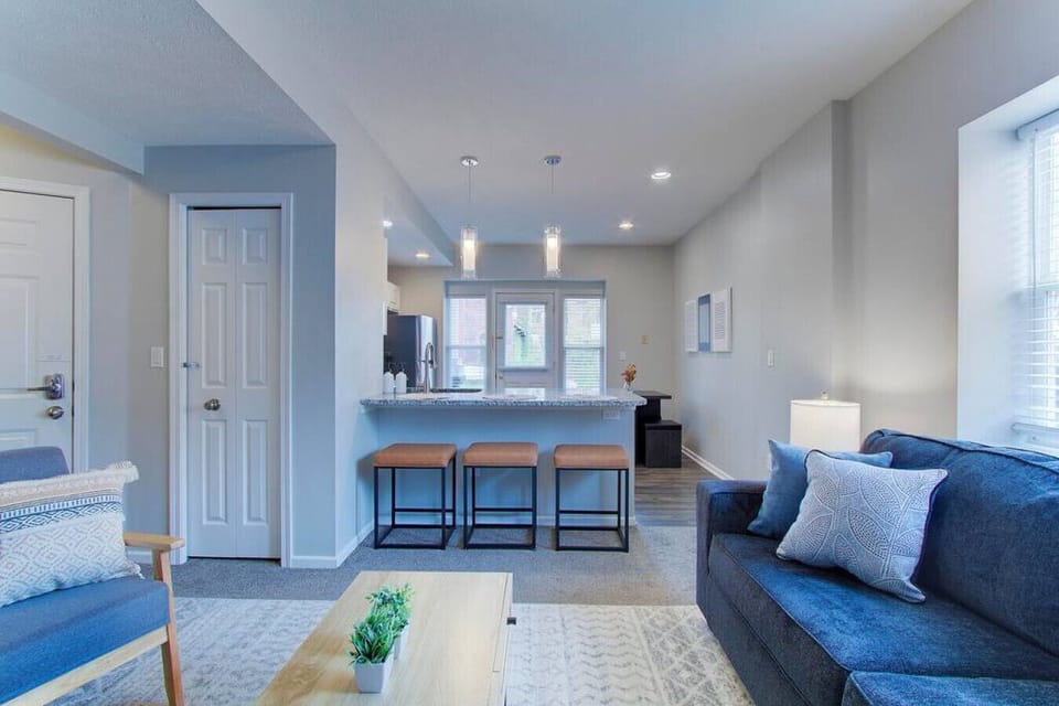 The open-concept layout connects the living room, kitchen, and dining area, creating a comfortable space for extended stays, travel nurses, and families visiting University Circle.