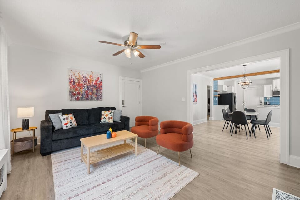 The spacious open-concept living area offers plenty of room to gather with family and friends, watch a movie, or simply unwind after a busy day.