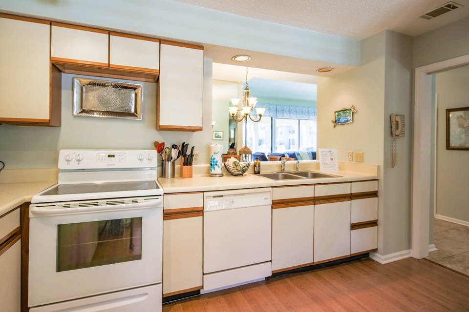 The kitchen opens into the dining area and living room.