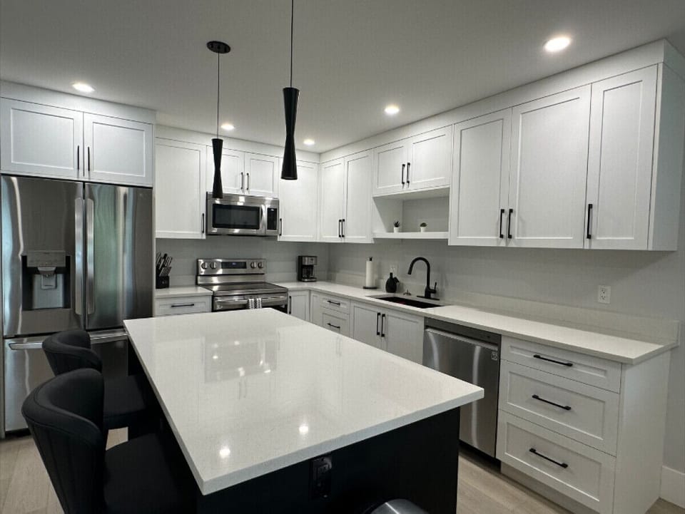 Enjoy the fully stocked kitchen with plenty of counter space, stainless steel appliances, and all the essentials to make dining in a breeze.