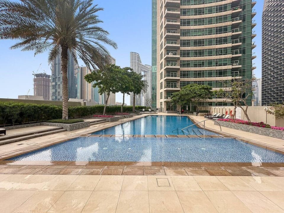 Poolside Oasis: Dive into luxury with stunning skyline views and refreshing waters await you!